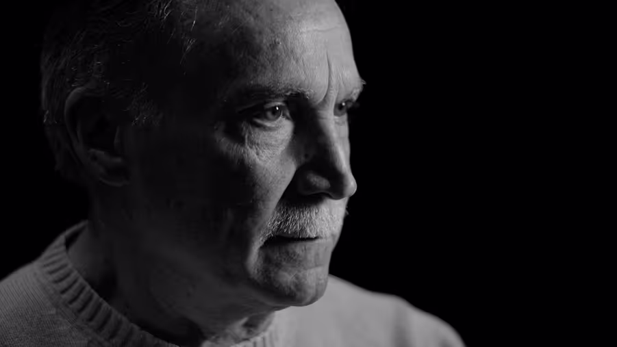 A picture of Keith in front of a black background